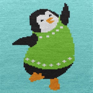 May include: A knitted illustration of a penguin wearing a green sweater with white star accents. The penguin has a white face, black head and wings, and orange feet and beak. The background is a light blue color.
