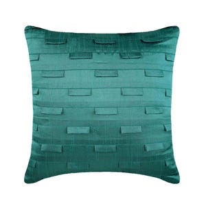 May include: A square teal throw pillow featuring a horizontal striped pattern with small, raised rectangular fabric tabs stitched across the surface in a repeating, staggered arrangement, creating a textured and dimensional appearance.