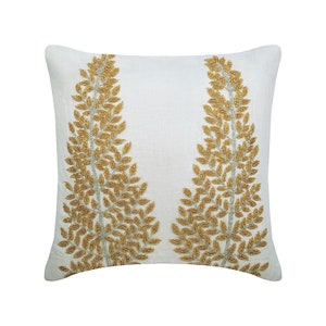 May include: White throw pillow with gold beaded embroidery of two leafy branches.