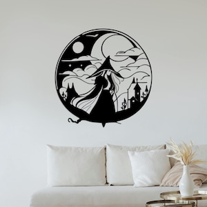 May include: Black and white silhouette wall art featuring a witch with a pointed hat and flowing cape, standing in front of a crescent moon and stars. The witch is walking towards a small village with houses and trees.