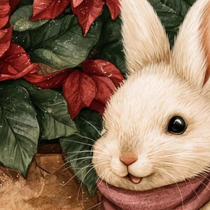 Close-up of the beach towel's watercolor art: the bunny's face, ears and berry-colored scarf in front of red poinsettias and green leaves.