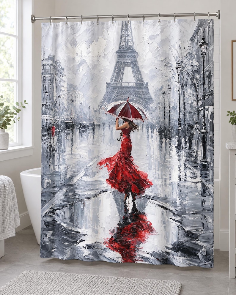 May include: A shower curtain featuring an oil painting style print of a person in a vibrant red dress holding a matching red and white umbrella. The scene depicts a rainy Paris street with the Eiffel Tower in the background, rendered in shades of gray.