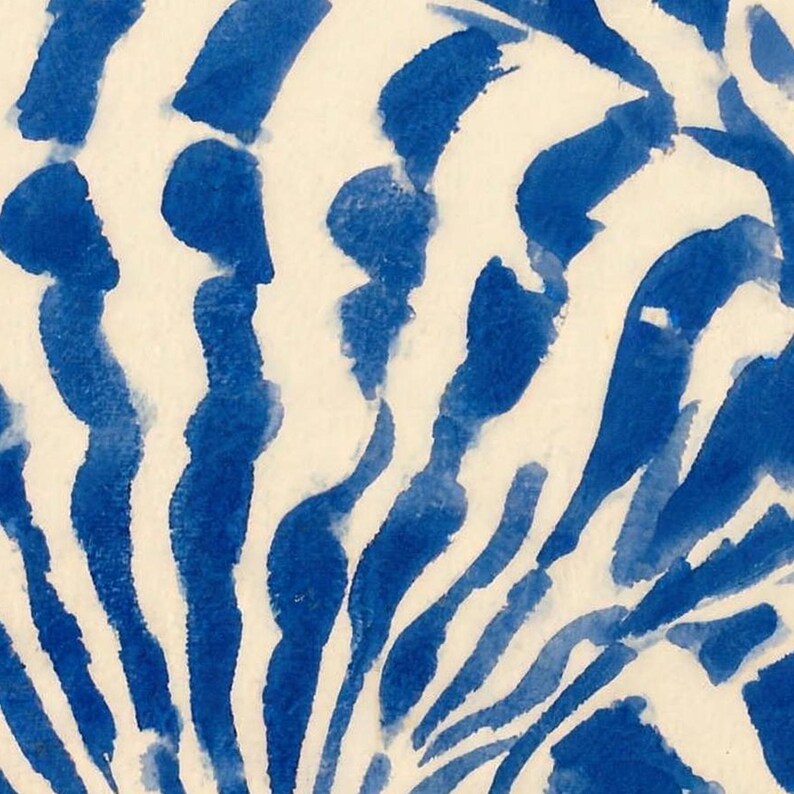Close-up of the shower curtain's print: brushy cobalt-blue watercolor stripes radiating across a cream scallop shell.