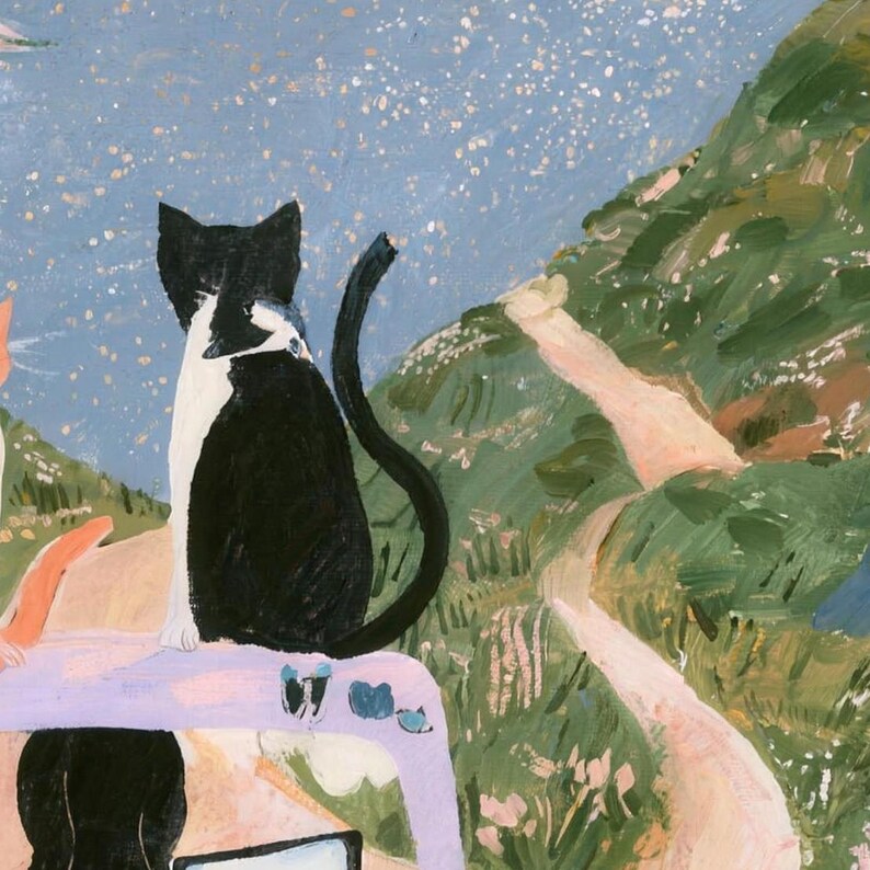 Close-up of the printed design on the bath mat: the black and white cat seen from behind on the lavender car, with the driver's dark hair below and a winding path through green hills.