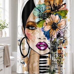 May include: A white shower curtain featuring a stylized watercolor illustration of a face with bright purple lips, large hoop earrings, and a cluster of orange, green, and blue flowers on the head, accented by black ink lines and stripes.