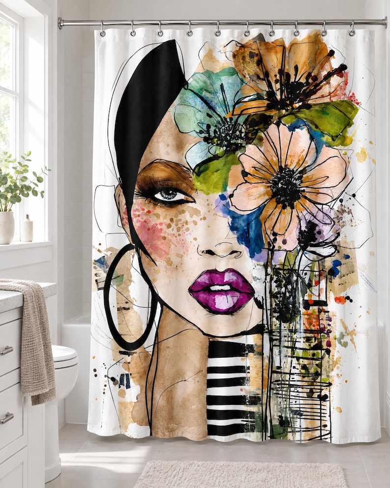 May include: A white shower curtain featuring a stylized watercolor illustration of a face with bright purple lips, large hoop earrings, and a cluster of orange, green, and blue flowers on the head, accented by black ink lines and stripes.