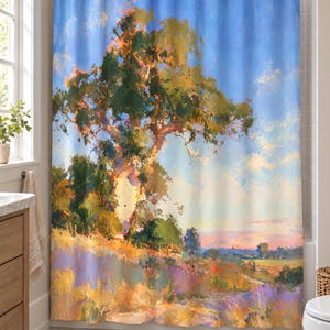 May include: A shower curtain featuring an impressionistic landscape painting of a large tree on a grassy hill under a bright blue sky. The scene includes warm golden sunlight, green foliage, and purple wildflowers in a painterly style with visible brushstrokes.
