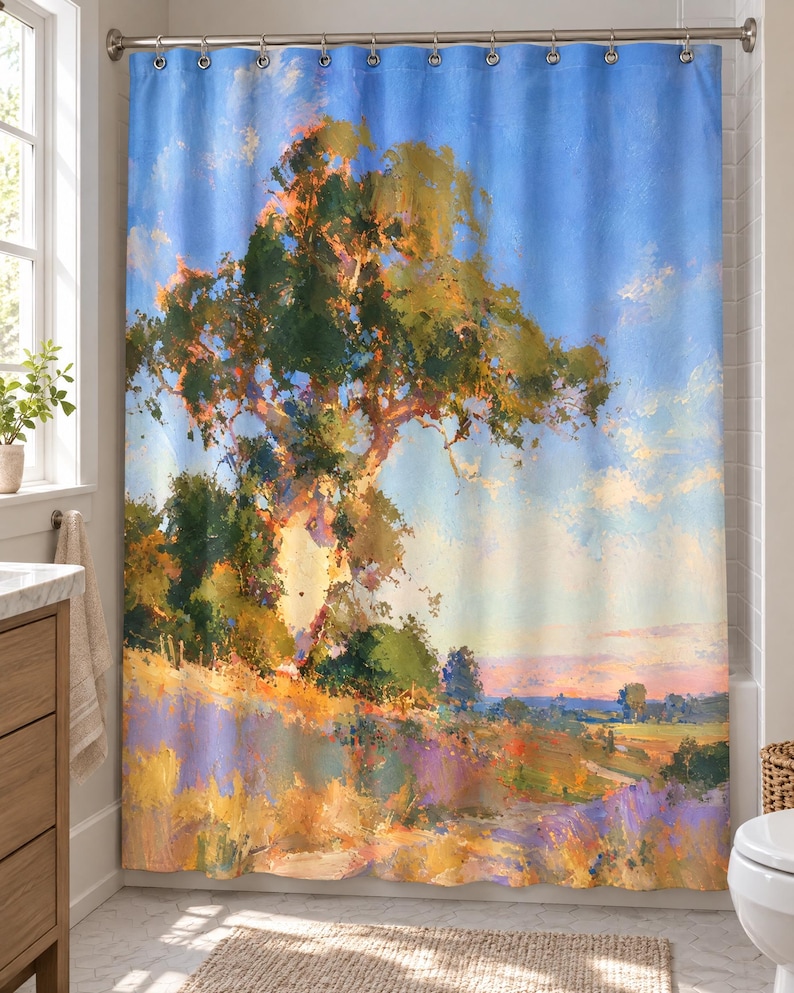 May include: A shower curtain featuring an impressionistic landscape painting of a large tree on a grassy hill under a bright blue sky. The scene includes warm golden sunlight, green foliage, and purple wildflowers in a painterly style with visible brushstrokes.