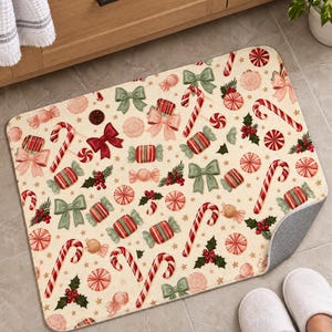 Candy cane Christmas bath mat in front of a wood vanity, one corner turned up to show the gray anti-slip back, with white slippers below.