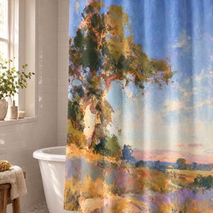 May include: A shower curtain featuring an impressionistic landscape painting of a large tree with golden and green foliage set against a bright blue sky. The scene includes a rolling field with warm yellow, orange, and purple tones at the base.