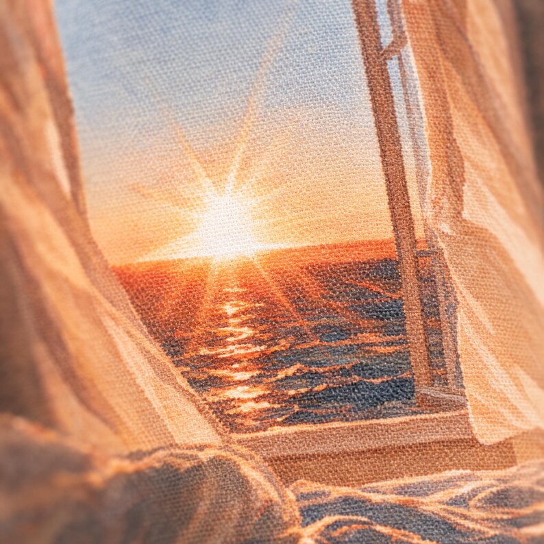 May include: A woven textile wall hanging featuring a detailed scene of a sunset over the ocean viewed through an open window. The image displays a bright orange sun, a dark blue sea with light reflections, and sheer curtains framing the window view.