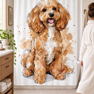 Wider view of a bright bathroom with the watercolor Cavapoo shower curtain closed across the tub, a wooden vanity and plant to the left and a woman in a white robe walking past barefoot on a woven rug.
