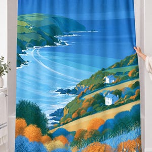 Retro sea cliff shower curtain over a bathtub in a white-tiled bathroom: a deep blue bay curves past green headlands, two white cottages and orange and blue shrubs in a flat graphic style; a hand pulls back the right edge.