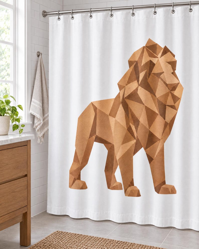 May include: A white shower curtain featuring a large, geometric lion illustration composed of various shades of brown and tan triangular shapes. The lion is depicted in a standing profile view, showcasing a faceted, angular design style.