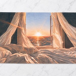 May include: A rectangular towel featuring a printed scene of a sunrise over the ocean viewed from an open window. White curtains blow inward over a rumpled bed with white bedding. The dark interior contrasts with the bright orange sun.
