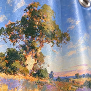 May include: A shower curtain featuring a printed landscape painting of a large, textured tree with green and orange foliage set against a bright blue sky with white clouds. The scene includes a rolling field with purple and yellow tones.
