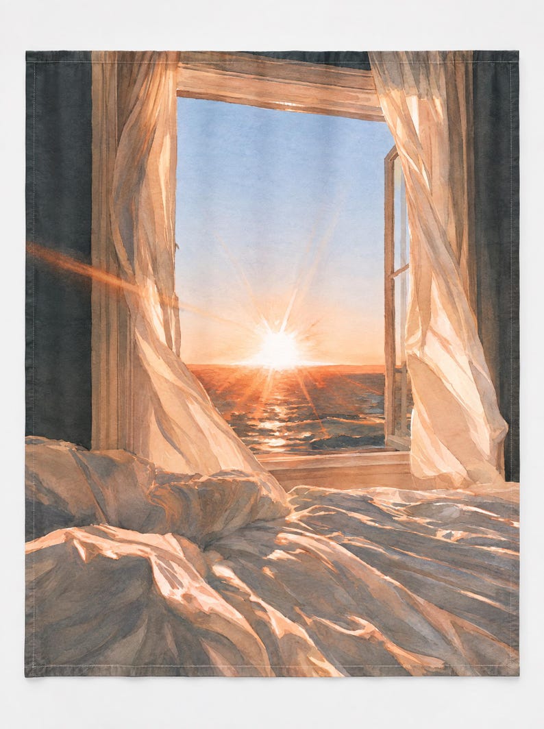 May include: A rectangular wall tapestry featuring a printed illustration of an open window overlooking a sunset over the ocean. White sheer curtains blow inward, and a rumpled white bedspread is visible in the foreground under golden light.
