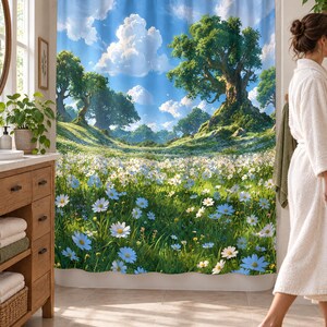 Wider view of a bright bathroom with the daisy meadow shower curtain closed across the tub, a wooden vanity with folded towels to the left and a woman in a white robe walking past barefoot on a woven rug.