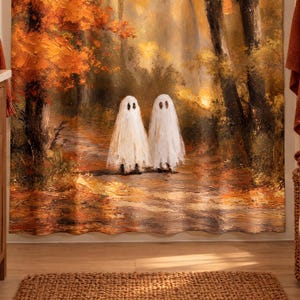 Halloween shower curtain with two cute sheet ghosts on an autumn forest path, hanging in a bathroom