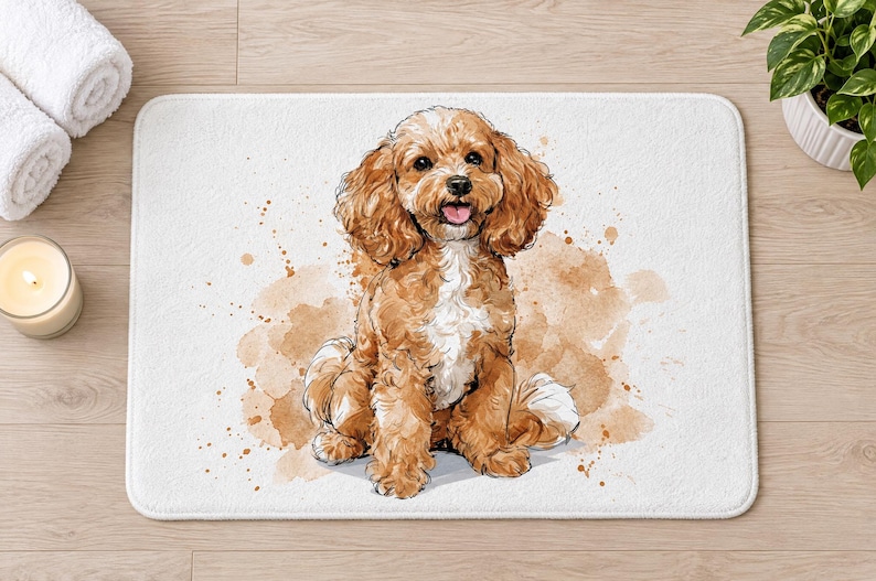 Overhead view of the whole Cavapoo puppy bath mat on a light wood floor, with rolled white towels, a lit candle and a potted plant beside it.