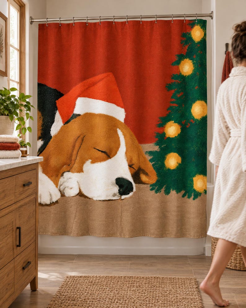 Sleeping beagle Santa hat shower curtain in a bright bathroom with a wood vanity and woven rug, as a woman in a white robe walks past.