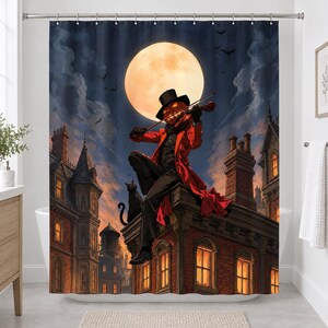 Straight-on view of the whole pumpkin violinist shower curtain hanging in a white bathroom, showing the full moon, bats, black cat, chimneys and lit windows of the gothic townhouses.