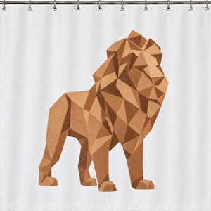 May include: A white shower curtain featuring a large, centred geometric lion illustration. The lion is composed of various shades of brown, tan, and copper triangular shapes, creating a faceted, low-poly appearance against the plain white background.