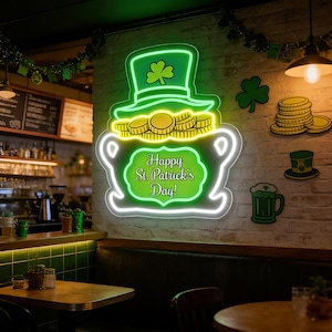 May include: A neon sign in the shape of a pot of gold with a green top hat and the text "Happy St. Patrick's Day!" The sign is surrounded by other St. Patrick's Day decorations, including shamrocks and a beer mug.