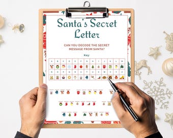 May include: A clipboard holds a Christmas-themed activity sheet titled "Santa's Secret Letter." The sheet features a key for decoding a secret message, with festive icons. A hand holds a pen, ready to solve the puzzle. The background is white with Christmas ornaments.