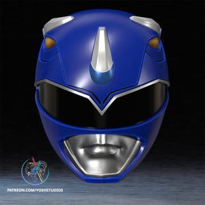 May include: A blue Power Ranger helmet with silver and gold accents. The helmet has a visor and a mouth area, with the text "PATREON.COM/YOSHSTUDIOS" at the bottom. The helmet is a cosplay item.