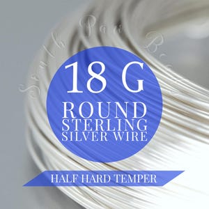 May include: A close-up of a coil of 18 gauge round sterling silver wire. The wire is half hard temper. The wire is white and shiny.