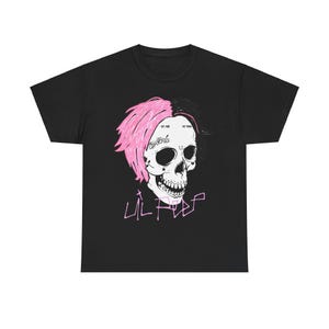 May include: Black t-shirt featuring a skull design with pink and black hair. The skull has the text "Lil Peep" in pink and other text on the forehead. A star is on the left side of the skull.