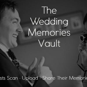 May include: A black and white photograph featuring a smiling person in a suit and a person holding a camera. The text reads: The Wedding Memories Vault. Guests Scan · Upload · Share Their Memories. The image captures a candid moment between two individuals.