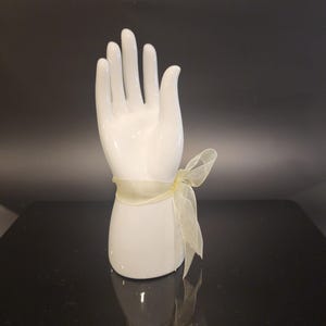 Vintage Ceramic Hand Display with Pastel Ribbon Bow