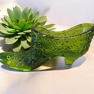 Vintage Glass slippers daisy and button pattern.