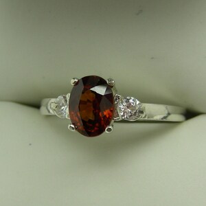 Fiery Spessartine Garnet Oval with Cubic Zirconian Accents Sterling Silver Ring