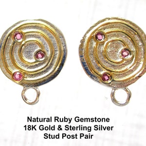 May include: A pair of 18K gold and sterling silver stud earrings with a circular design and three pink ruby gemstones.  Natural Ruby Gemstone 18K Gold & Sterling Silver Stud Post Pair