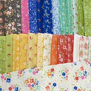 May include: A collection of colorful fabric squares with floral patterns. The fabrics feature various colors, including pink, blue, green, yellow, and orange, with small flower and dot designs. The fabrics are neatly stacked, showcasing a variety of patterns.