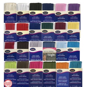 May include: Assortment of 18 spools of bias tape in various colors, including white, red, black, green, blue, pink, purple, brown, yellow, and orange. Each spool is labeled "Bias Tape Maxi Piping" and includes the brand name "Wrights".