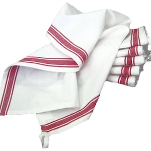 May include: A stack of white kitchen towels with red stripes. The towels are folded and stacked on top of each other.