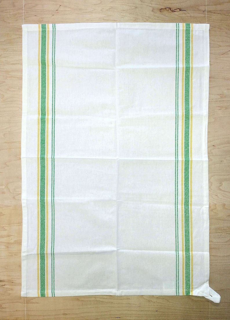 May include: White kitchen towel with green and yellow stripes along the sides.