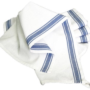 May include: White kitchen towel with two blue stripes along the edge. The towel is folded and has a loop for hanging.