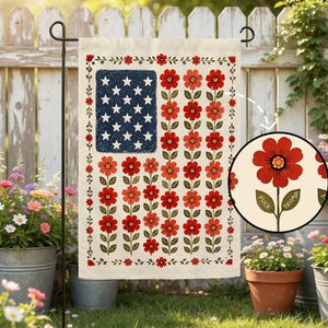May include: A garden flag with a floral American flag design. The flag features a blue rectangle with white stars, red flowers, and the words "FUCK TRUMP" on a flower in a circle.
