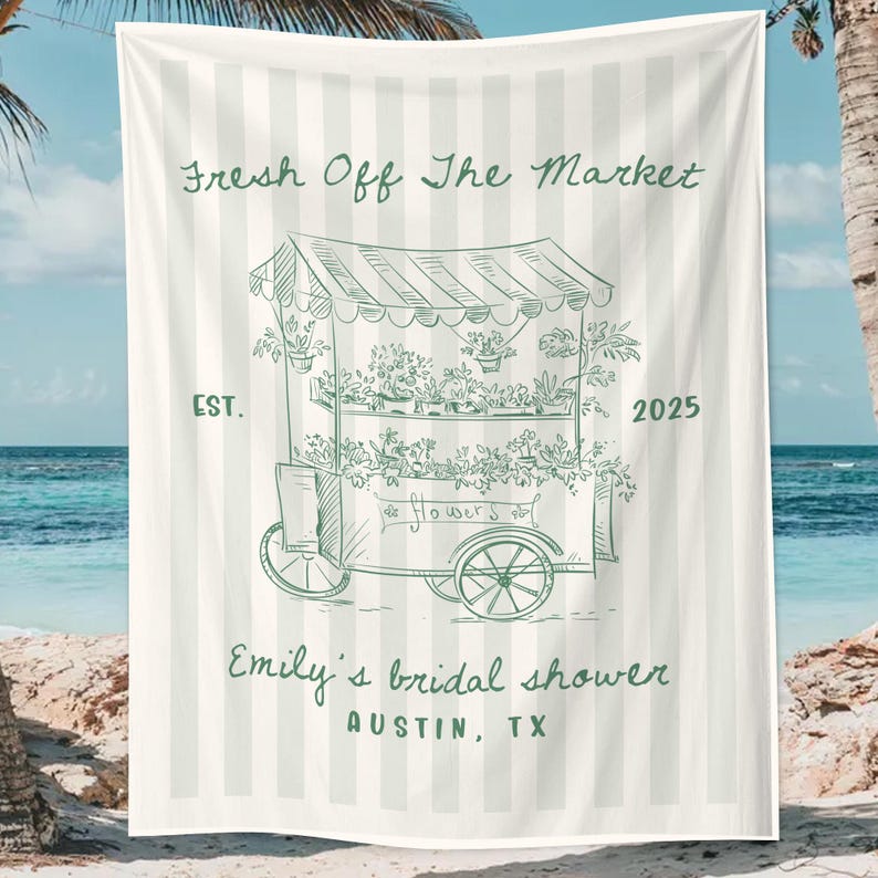 May include: Beach towel with a green and white striped background. The towel features a green illustration of a flower cart with the text "Fresh Off The Market" and "Emily's bridal shower Austin, TX".
