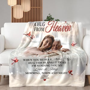 May include: A white fleece blanket with a photo of a couple, a red robin, and the text "A hug from Heaven. When you really miss me hug this blanket tight I'm sending you my love & hug morning, noon and night Dad 1950-2024".