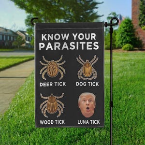 May include: Black garden flag with white text that reads "Know Your Parasites". The flag shows illustrations of four different types of ticks: deer tick, dog tick, wood tick, and luna tick. The luna tick is illustrated with a cartoon image of Donald Trump's face.