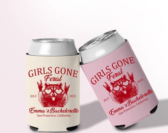 May include: Two can coolers, one cream and one pink, with a raccoon graphic wearing heart-shaped sunglasses. Text reads "GIRLS GONE Feral" and "Emma's Bachelorette, San Francisco, California, July 2025."