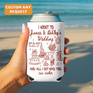 May include: White can cooler with a red illustration and text. The text reads "I went to James & Ashley's Wedding" with the date "SEP 22, 2025" and "Charleston, SC". The bottom text says "AND ALL I GOT WAS THIS can cooler".