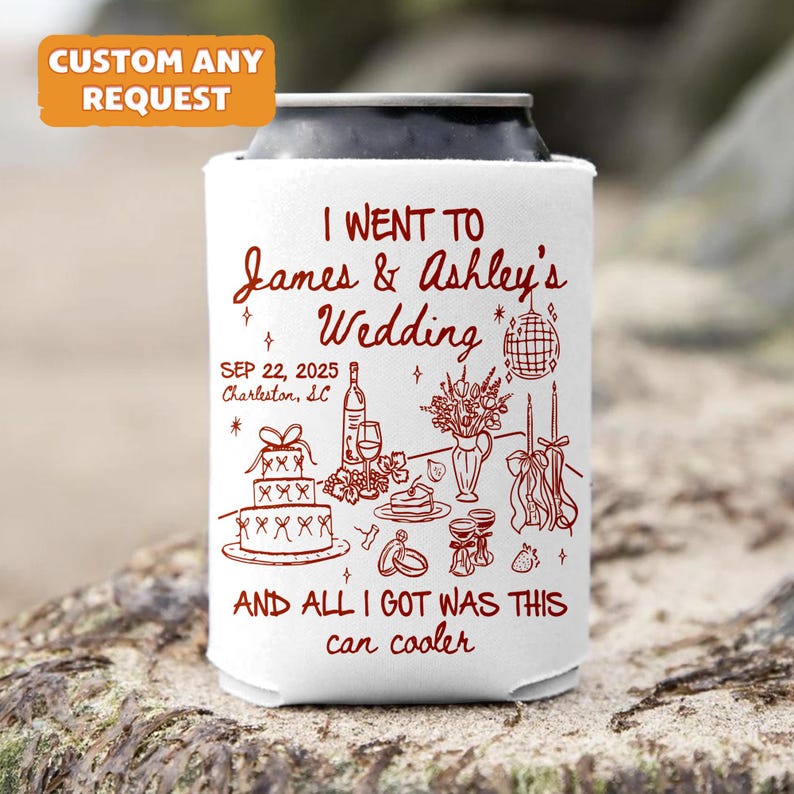 May include: White can cooler with red text and illustrations. The text reads "I WENT TO James & Ashley's Wedding SEP 22, 2025 Charleston, SC AND ALL I GOT WAS THIS can cooler." Includes wedding-themed graphics.