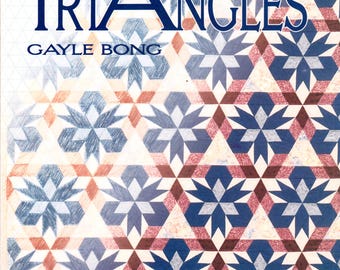 May include: A book cover with the title "Trouble Free Triangles" by Gayle Bong. The cover features a quilt design with a repeating pattern of blue and red stars on a white background. The text "Quilt Designs Based on Rotary-Cut 60° Triangles" is at the bottom of the cover.